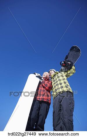couple enjoying snow board View Large Photo Image Stock Photo - couple enjoying snow board. Fotosearch