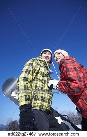 couple enjoying snow board View Large Photo Image Stock Photo - couple enjoying snow board. Fotosearch