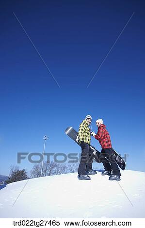 couple enjoying snow board View Large Photo Image Stock Photography - couple enjoying snow board. Fotosearch