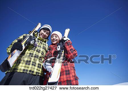 Stock Photo - couple have a great time in ski resort. Fotosearch