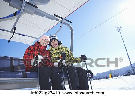 couple smile on ski lift View Large Photo Image Stock Image - couple smile on ski lift. Fotosearch