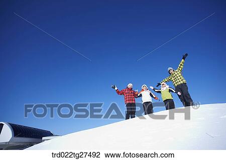 family having fun in ski resort View Large Photo Image Stock Image - family having fun in ski resort. Fotosearch