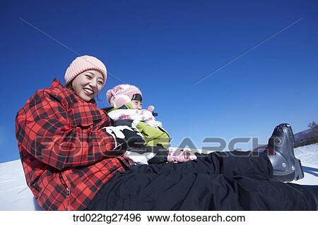 family having fun in ski resort View Large Photo Image Stock Photograph - family having fun in ski resort. Fotosearch