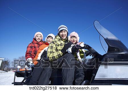 family riding a motor ski vehicle View Large Photo Image Stock Photo - family riding a motor ski vehicle. Fotosearch