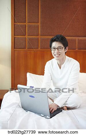 man working on the bed View Large Photo Image Stock Photo - man working on the bed. Fotosearch