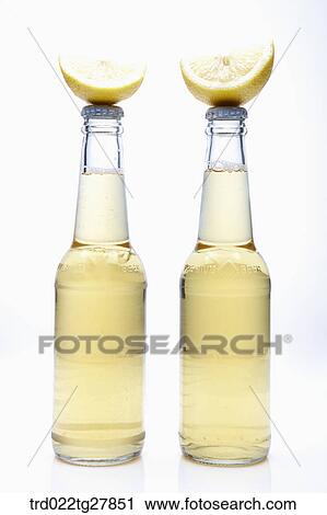 bottled beer with lemon slice View Large Photo Image Stock Image - bottled beer with lemon slice. Fotosearch