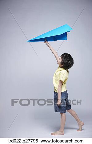 Stock Photography - children education boy flying paper plane. Fotosearch