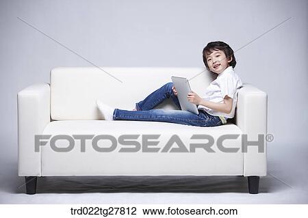 children education boy using tablet pc View Large Photo Image Stock Image - children education boy using tablet pc. Fotosearch