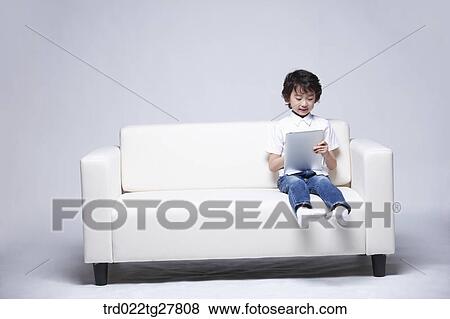 Stock Photo - children education boy using tablet pc. Fotosearch
