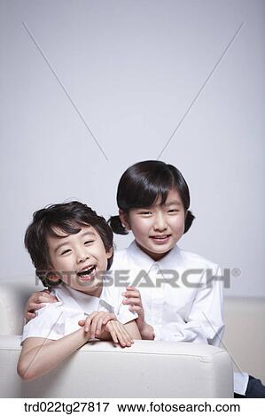 children education sitting on sofa together View Large Photo Image Stock Photo - children education sitting on sofa together. Fotosearch