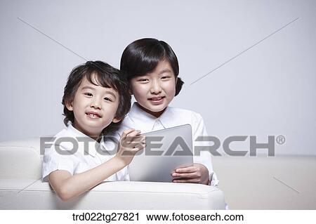Stock Image - children education using tablet pc . Fotosearch