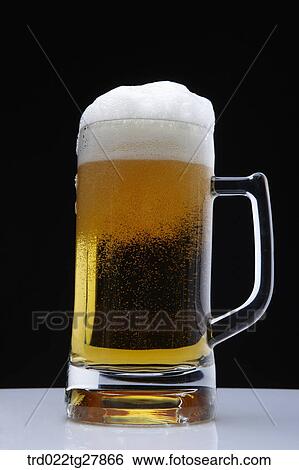 Stock Photograph - draft beer with foams. Fotosearch