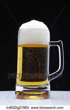 Stock Photography - draft beer with foams. Fotosearch