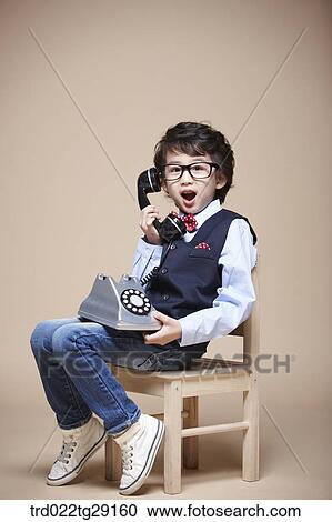 boy answering the phone View Large Photo Image Stock Image - boy answering the phone. Fotosearch