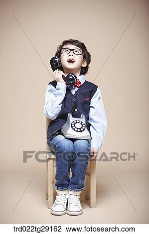 boy answering the phone View Large Photo Image Stock Image - boy answering the phone. Fotosearch