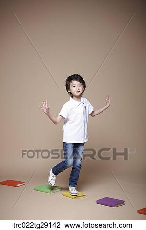 boy crosses stepping stones View Large Photo Image Stock Image - boy crosses stepping stones. Fotosearch