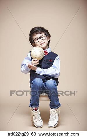 boy holding globe View Large Photo Image Stock Image - boy holding globe. Fotosearch
