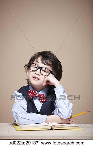 Stock Photo - boy is studying. Fotosearch