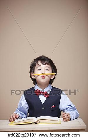 Stock Photo - boy is studying. Fotosearch