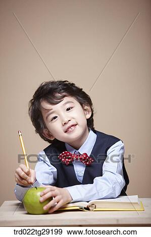 Stock Photo - boy is studying. Fotosearch