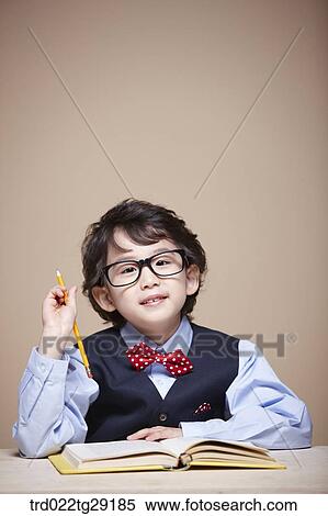 Stock Photography - boy is studying. Fotosearch