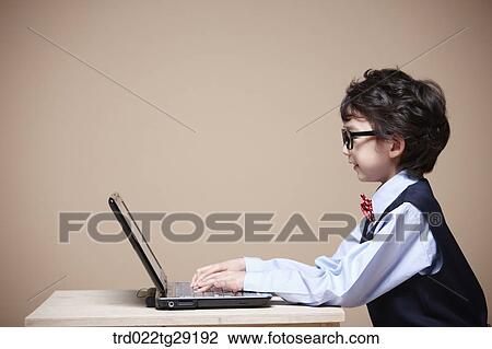 boy is studying using laptop View Large Photo Image Stock Image - boy is studying using laptop. Fotosearch