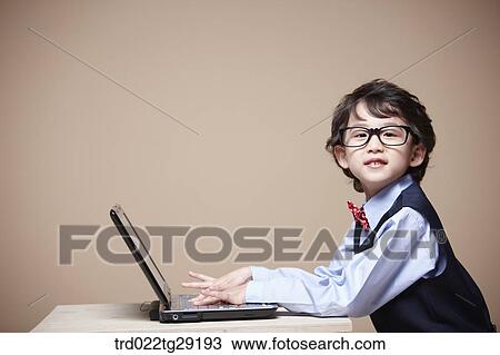 boy is studying using laptop View Large Photo Image Stock Image - boy is studying using laptop. Fotosearch