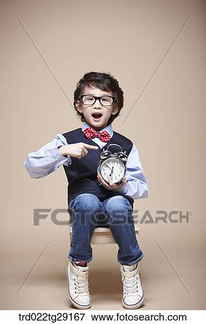 boy pointing at clock View Large Photo Image Stock Photo - boy pointing at clock. Fotosearch