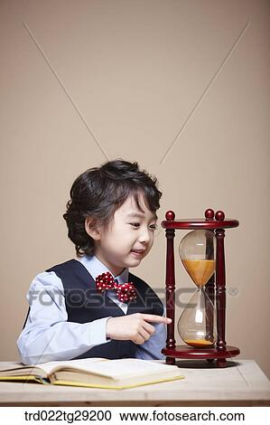 boy pointing at sandclock View Large Photo Image Stock Image - boy pointing at sandclock. Fotosearch