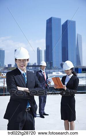 business people at construction site are in confidence View Large Photo Image Stock Image - business people at construction site are in confidence. Fotosearch