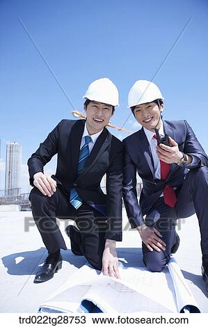 business people at construction site are in confidence View Large Photo Image Stock Image - business people at construction site are in confidence. Fotosearch