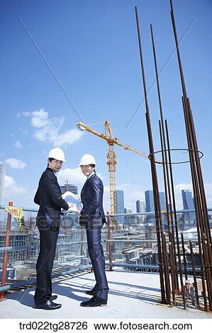 business people at construction site are in confidence View Large Photo Image Stock Photograph - business people at construction site are in confidence. Fotosearch
