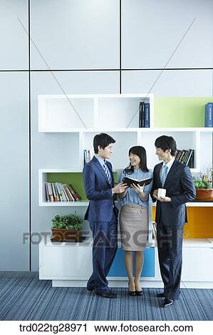 business people reads book together in office View Large Photo Image Stock Image - business people reads book together in office. Fotosearch