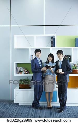 business people reads book together in office View Large Photo Image Stock Photo - business people reads book together in office. Fotosearch