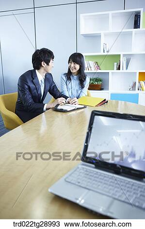 Stock Image - business people working together in office. Fotosearch