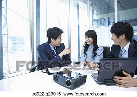 Stock Photography - business people working together in office. Fotosearch
