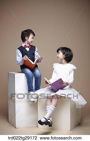 Stock Image - children reading books. Fotosearch