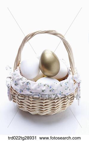 eggs and golden egg in basket View Large Photo Image Stock Image - eggs and golden egg in basket. Fotosearch