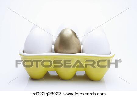 Stock Image - eggs and golden egg. Fotosearch