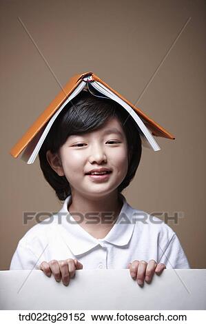 girl balancing a book on her head View Large Photo Image Stock Image - girl balancing a book on her head. Fotosearch