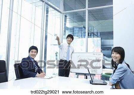 man doing presentation to people in meeting room View Large Photo Image Stock Image - man doing presentation to people in meeting room. Fotosearch