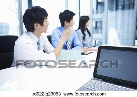 Stock Image - people take partipate in meeting. Fotosearch