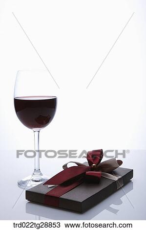 Stock Image - present and wine. Fotosearch