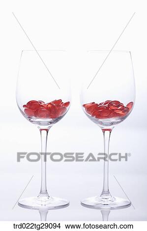 red buttons in wine glass View Large Photo Image Picture - red buttons in wine glass. Fotosearch