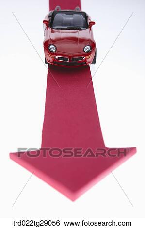 Stock Photograph - red minicar and red arrow sign. Fotosearch
