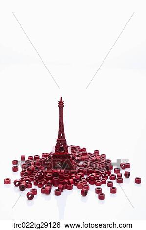 Stock Photograph - red rolls and red color Eiffel tower. Fotosearch