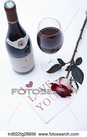 Stock Photograph - wine and rose with greeting card. Fotosearch