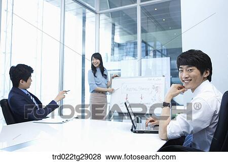 woman doing presentation to people in meeting room View Large Photo Image Stock Photo - woman doing presentation to people in meeting room. Fotosearch