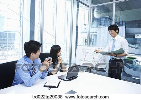 woman doing presentation to people in meeting room View Large Photo Image Stock Photo - woman doing presentation to people in meeting room. Fotosearch