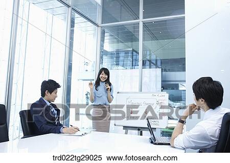 woman doing presentation to people in meeting room View Large Photo Image Stock Photography - woman doing presentation to people in meeting room. Fotosearch